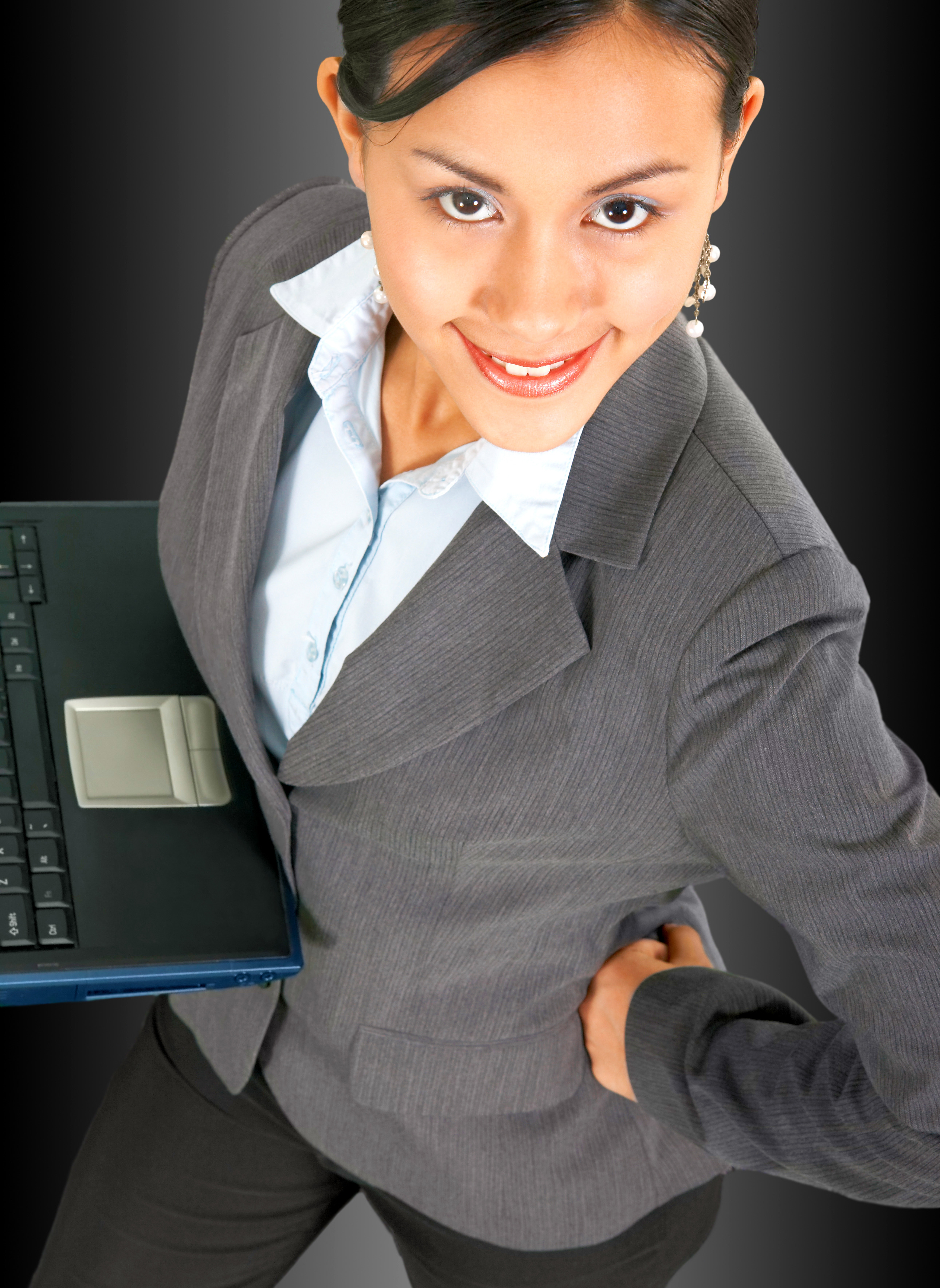 Successful Confident Business Woman Using A Notebook Computer
