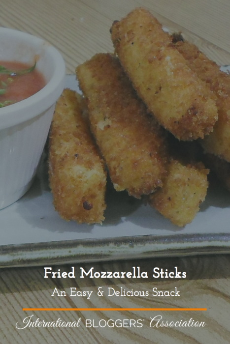Fried Mozzarella Sticks - Looking for a yummy snack? Well, look no further! These easy Fried Mozzarella Sticks will have you cooking before you know it.
