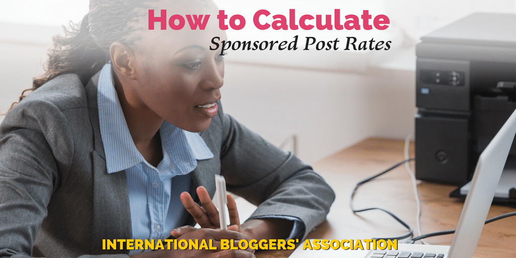 business woman at computer with text overlay "How to Calculate Sponsored Post Rates."