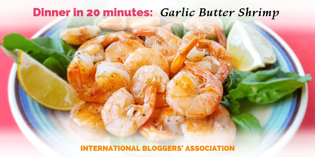plate of tail on shrimp with text overlay "Dinner in 20 minutes: Garlic Butter Shrimp."