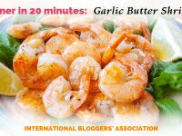 plate of tail on shrimp with text overlay "Dinner in 20 minutes: Garlic Butter Shrimp."