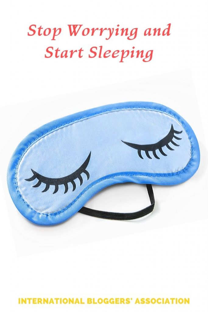 a sleep mask with text overlay "Stop Worrying and Start Sleeping"